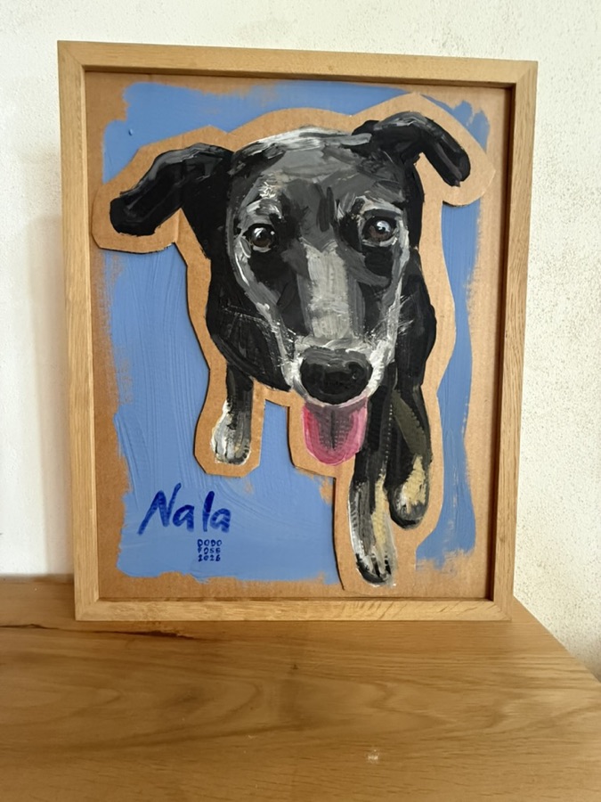 A finished portrait, framed